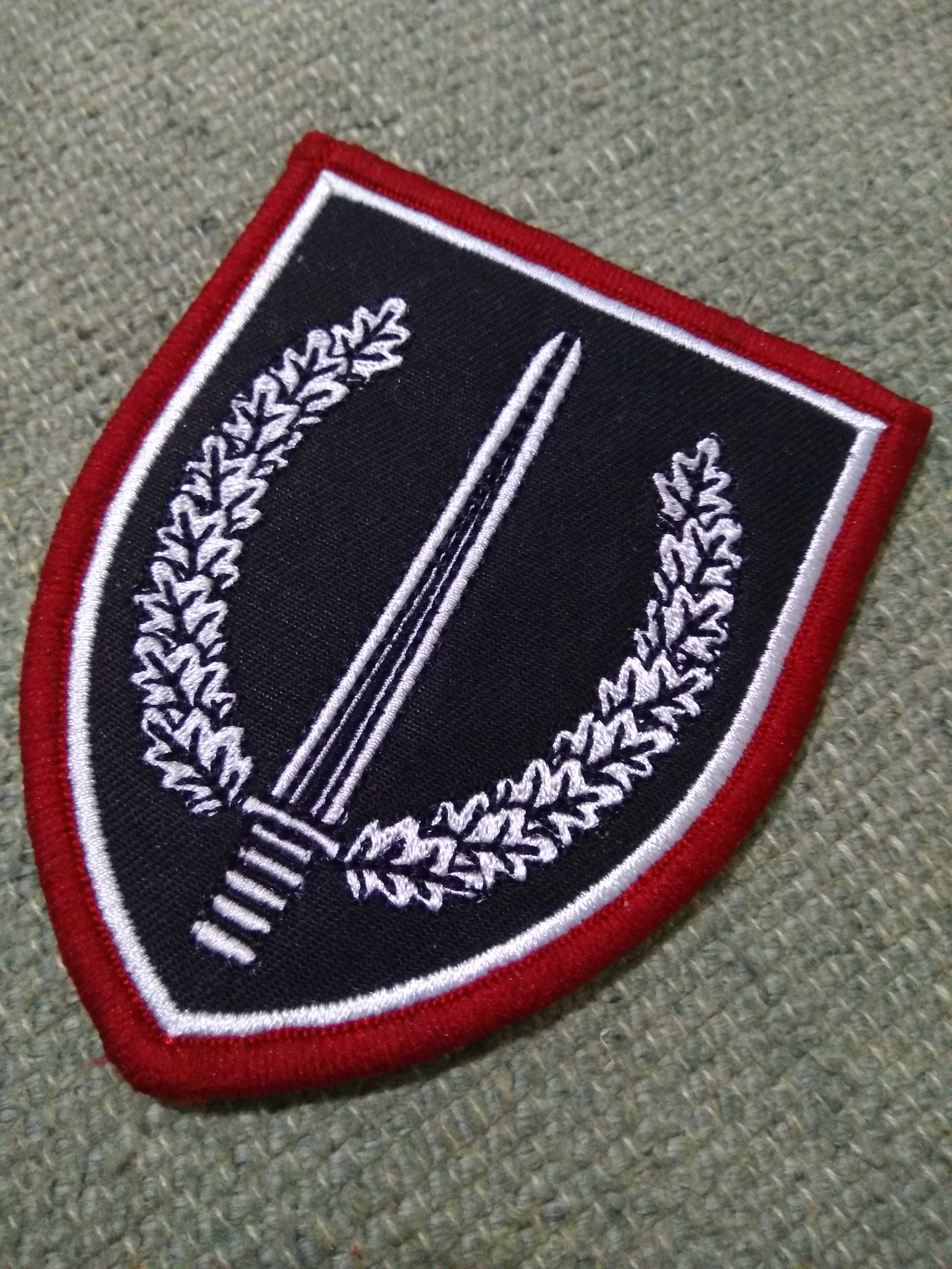 German ksk arm badge with red side magic sticker on the red side