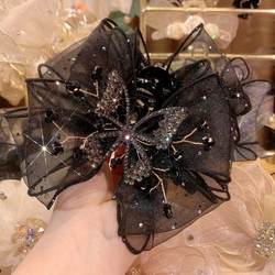 Grab clip ຜູ້ຍິງປີ 2023 ໃໝ່ high-end double-sided bow hair clip back head clip headwear large shark clip hair clip