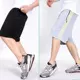 [Mua một tặng một] quần short nam mùa hè năm quần cộng với phân bón XL thể thao đi biển quần rộng béo jogger nam