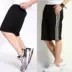 [Mua một tặng một] quần short nam mùa hè năm quần cộng với phân bón XL thể thao đi biển quần rộng béo jogger nam Quần short