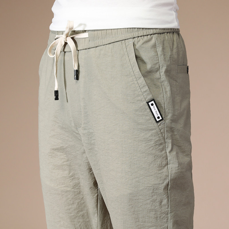 Sports pants men's Korean version of the trend elastic and versatile thin breathable slim-fitting small feet loose summer youth casual pants