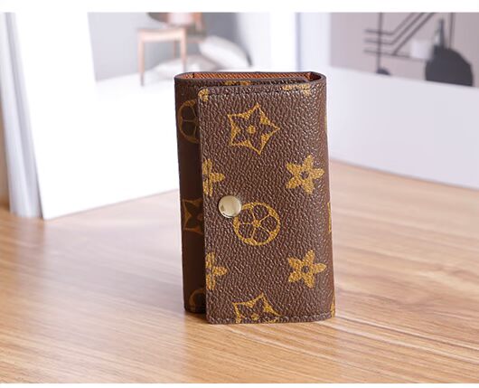 2018 mới châu Âu và Mỹ retro cao cấp xe chìa khóa túi xách nữ chìa khóa túi chìa khóa thẻ nam đa chức năng ví móc chìa khóa nữ