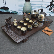 Solid wood ebony tea tray kung fu tea set Xianglong Xiangyun Wanfu tea tea table four-in-one electric heating furnace