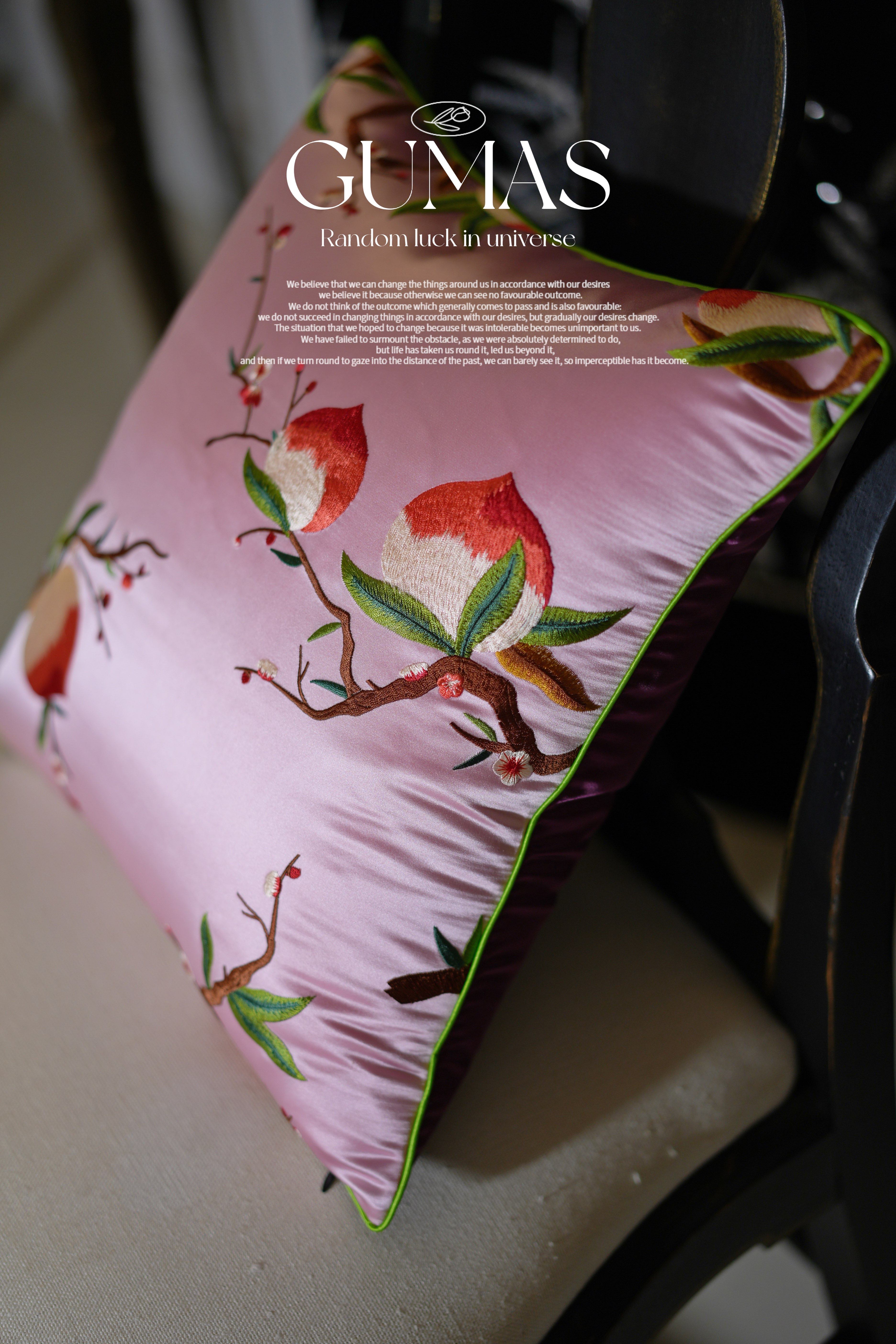 Traditional Chinese peach blossom embroidered throw pillow on sofa