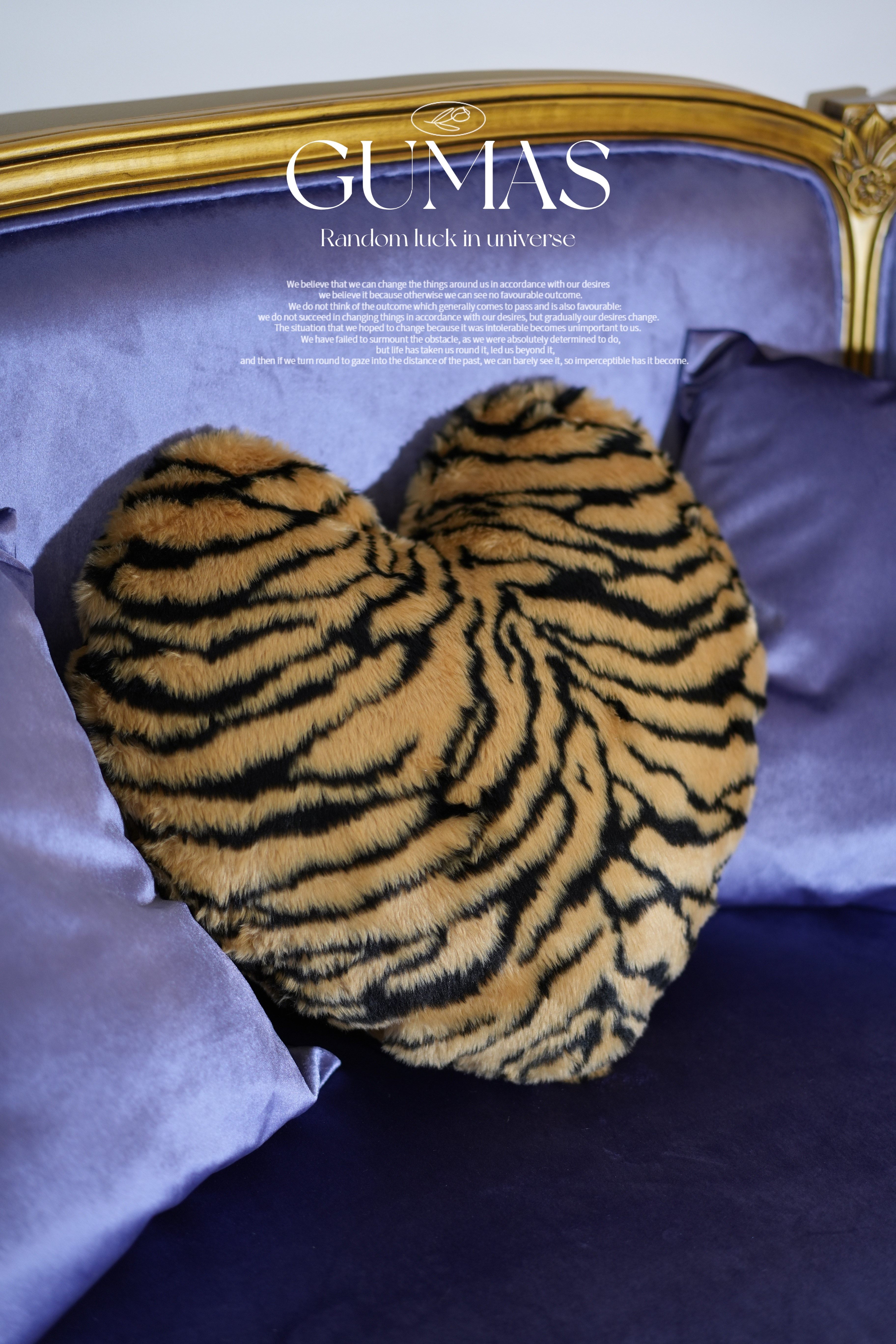 Heart shaped tiger stripe pillow 18x22 inches on vintage upholstered furniture