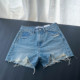 European and Korean version 2025 summer new product light blue ripped high waist denim shorts tassel raw edge hot pants wide leg pants for women