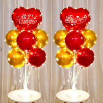 In the wedding room we are engaged and the table floats with balloons to decorate the wedding banquet background wall.