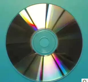 Discarded scrapped discs, old discs, burned discs, decorative discs, bad discs, scrap discs, large number of scrap discs