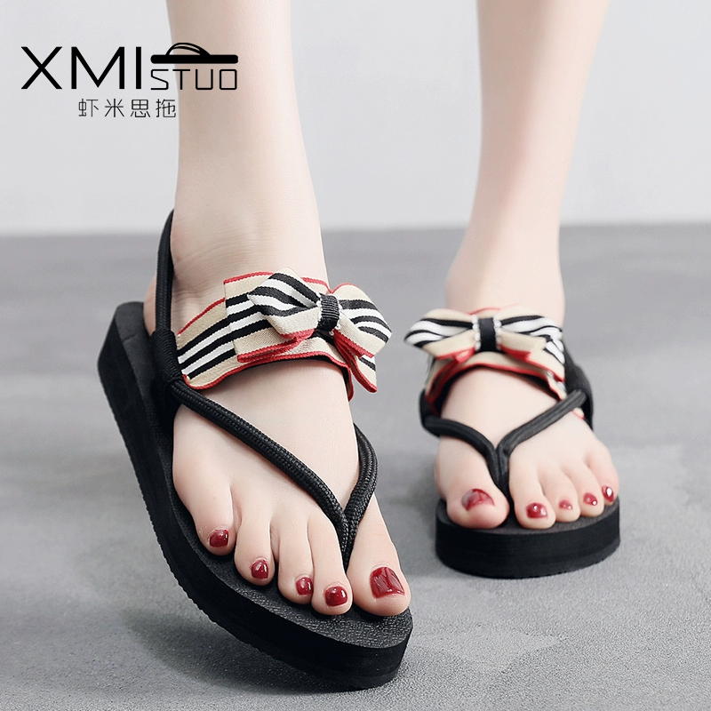 Flip-flops nữ mùa hè dép mặc ngoài thời trang hoang dã nơ dép phẳng ròng dép đi biển đỏ 