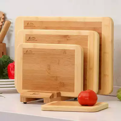 On the bamboo kitchen cutting board household carbonized thickened cutting board large kneading panel combination wooden chopping board set is easy to clean