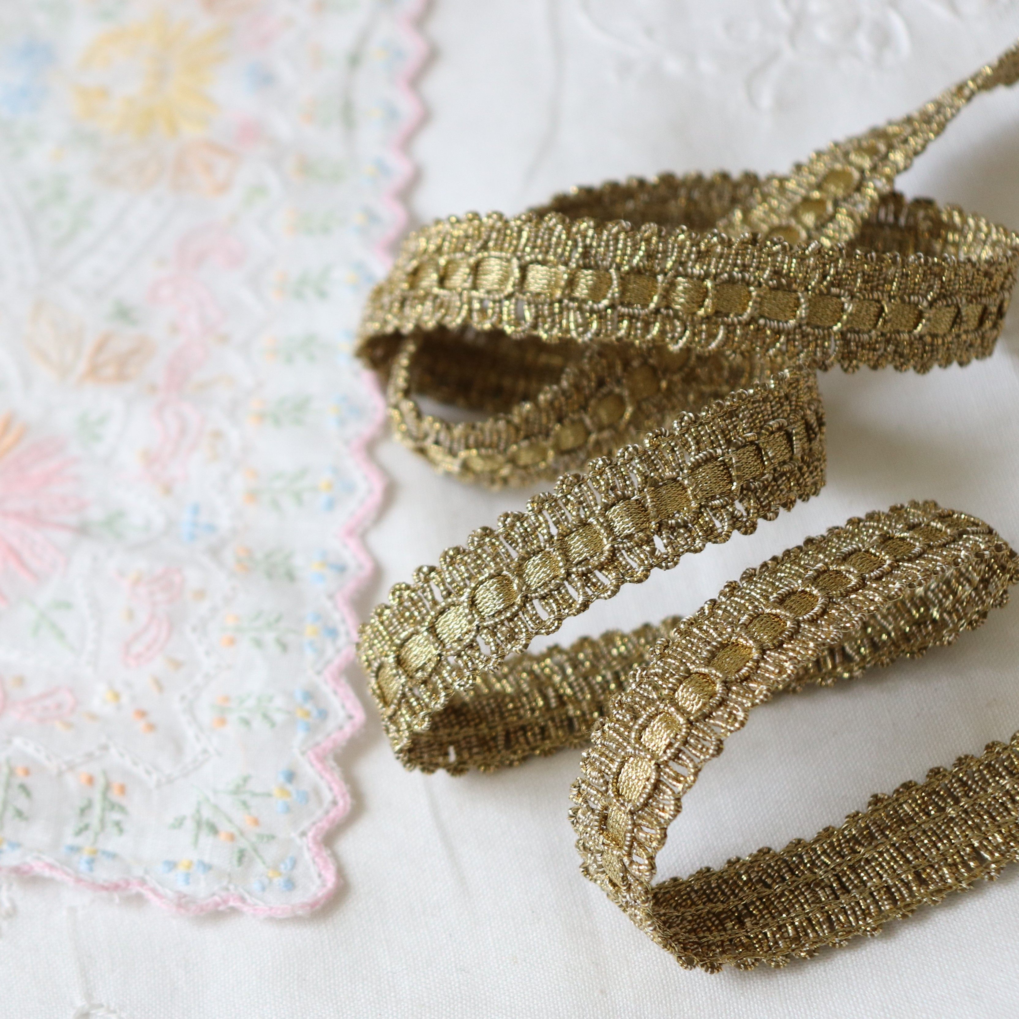 Made in japan, this shimmering, woven, rayon-blend ribbon features a ...