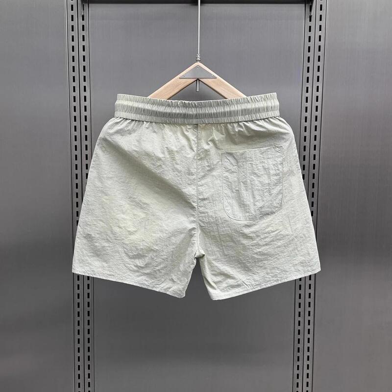 2026 Summer Trendy Thin Versatile Quick-Dry Shorts Men's Casual Quarter-Length Pants Couple Drawstring Solid Color Beach Shorts Men 2026 Summer Trendy Thin Versatile Quick-Dry Shorts Men's Casual Quarter-Length Pants Couple Drawstring Solid Color Beach Shorts Men