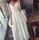 New seaside ວັນພັກ temperament fringed feather V-neck sexy suspender ຍາວ skirt ຕອນແລງ dress bridesmaid dress dress