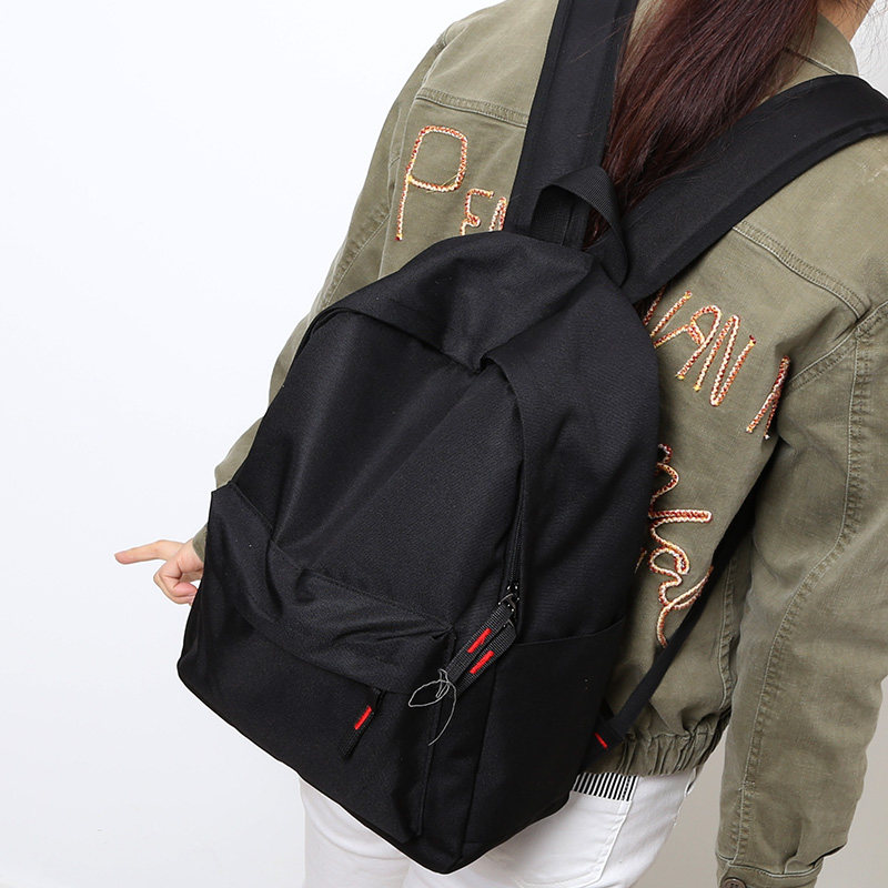 NR black waterproof pure color double shoulder bag female Korean version high school bag male college student body bag female double shoulder large and small