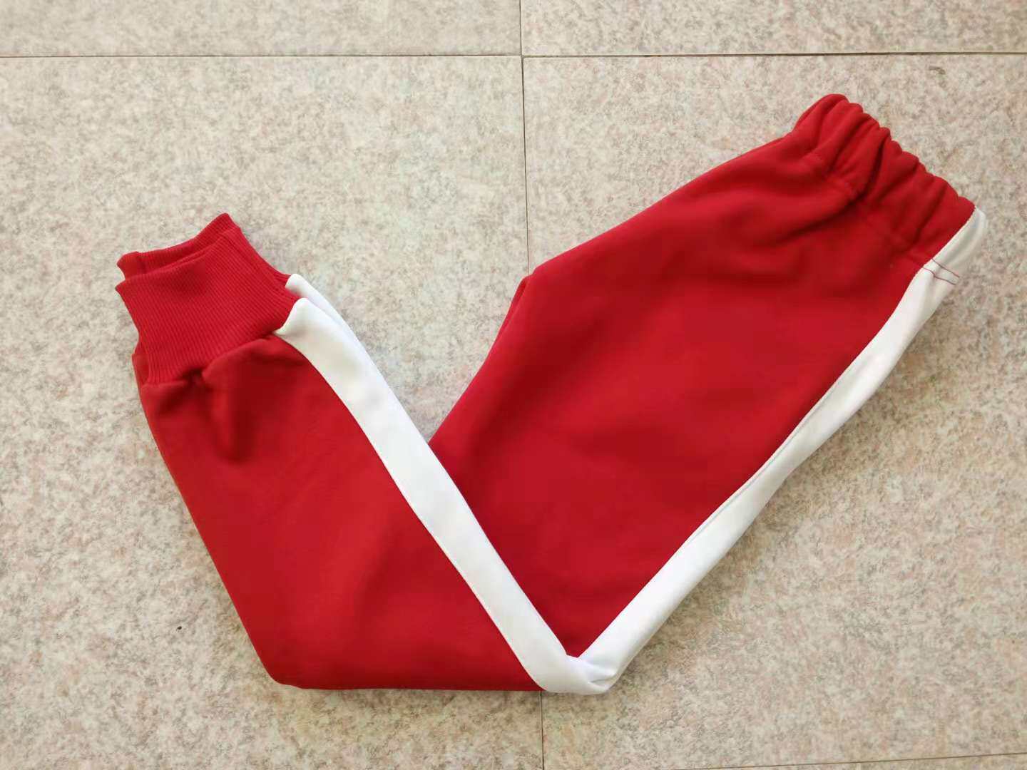 Primary and secondary students plus pure cotton red uniform white side a bar for male and female students white autumn and winter neutral sports pants