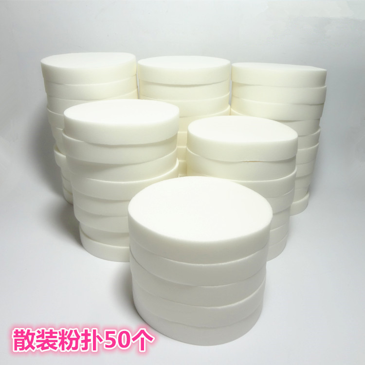 Photo studio makeup artist with round puff Big white puff sponge puff wet puff Foundation cream