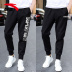 Quần Anta quần bó sát nam màu đen cộng với quần nhung 2018 thu đông và quần ống rộng chân đan quần bó sát. quần nike nam Quần thể thao
