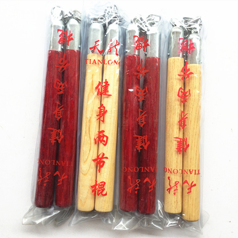 Taekwondo scattered with wooden double-cut-stick double-section stick with three knobbe sticks to practice the stick to perform stick-proof stick