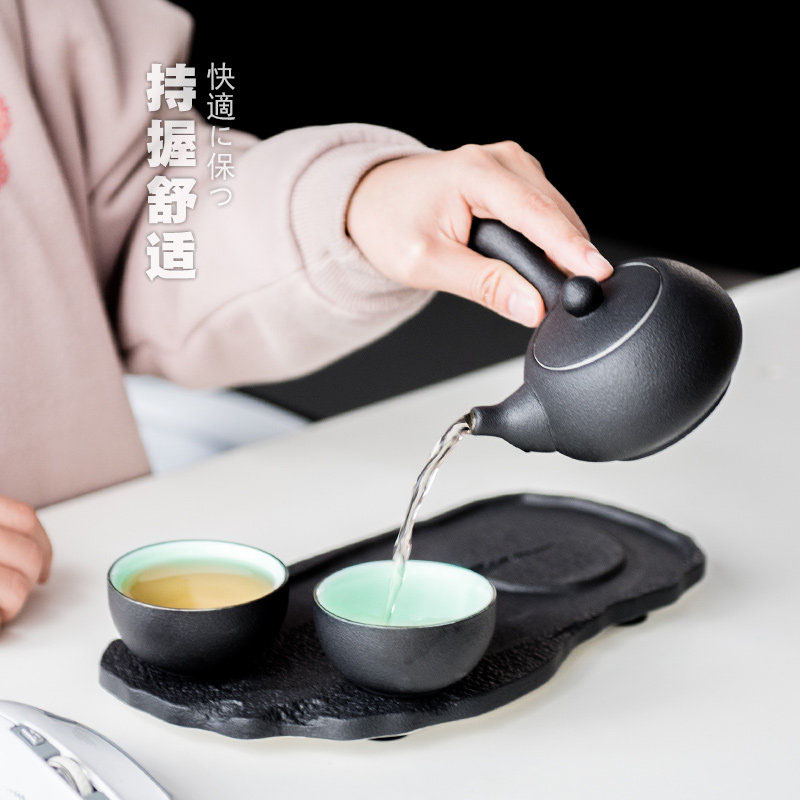 British green side between ink pot of Japanese kung fu tea set ceramic teapot set with a pot of tea tray two cups