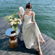 French white sling backless a-line dress female summer high-end sweet Sanya seaside holiday fairy skirt