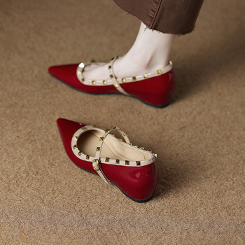 Women's evening shoes with elevated pointed toe and shallow rivets