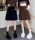 Corduroy mid-skirt with big pockets covers the crotch and looks slimming