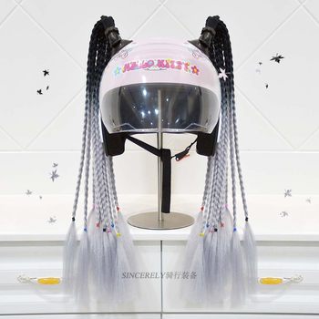 A pair of motorcycle helmets with sucker braids, riding and ski helmet decorations, electric bike riders’ personalized dreadlocks, detachable