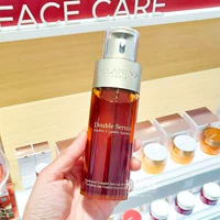 Clarins, золотая разглаживающая восстанавливающая увлажняющая осветляющая эссенция, 50 мл, 100 мл