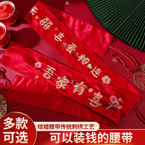 A complete collection of wedding supplies for the bride and groom a red dowry belt and a money belt for the bride and groom.