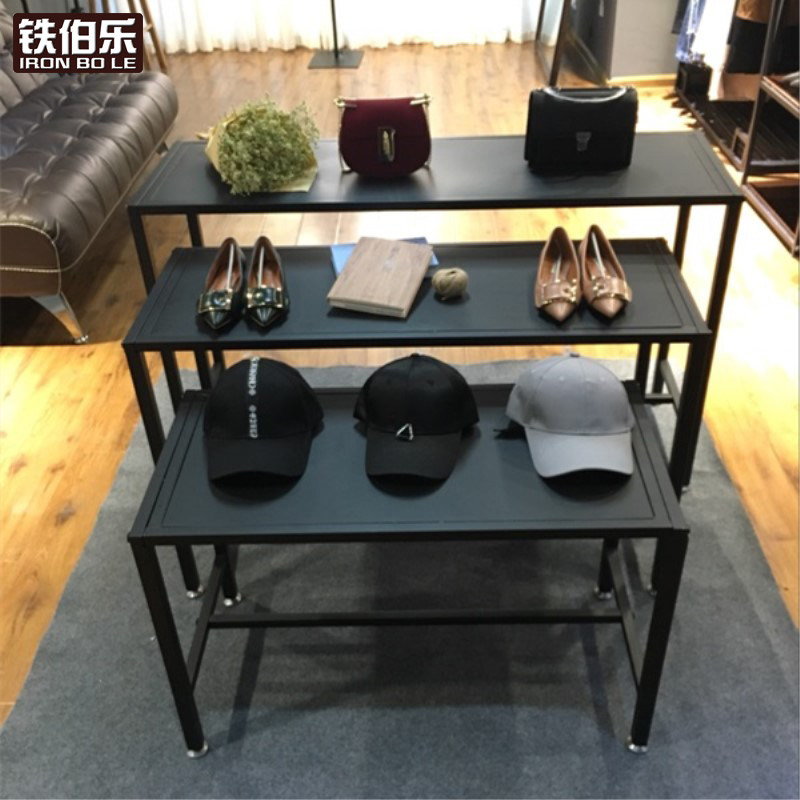 Clothing store running water Taichung Island display table boys and girls clothing shelf window height storage shoe cabinet bag landing
