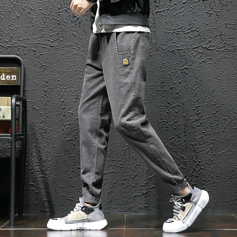 Men's jeans Chauffles casual bunches of Korean versions trendy long pants handsome and loose tooling pants with ruffles.