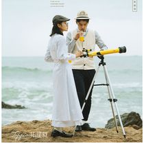 Travel props Large vertical yellow astronomical telescope Silver wedding photography Location photography Documentary wind beach
