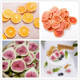 Small fresh birthday cake decoration dried grapefruit slices fig dried grapefruit orange slices lemon slices dried tea