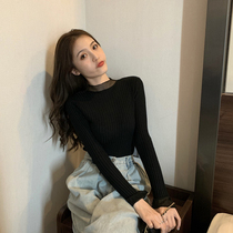 Autumn-winter setting with black long sleeves semi-high collar knit sweater with undershirt woman with a small crowdsourced jacket