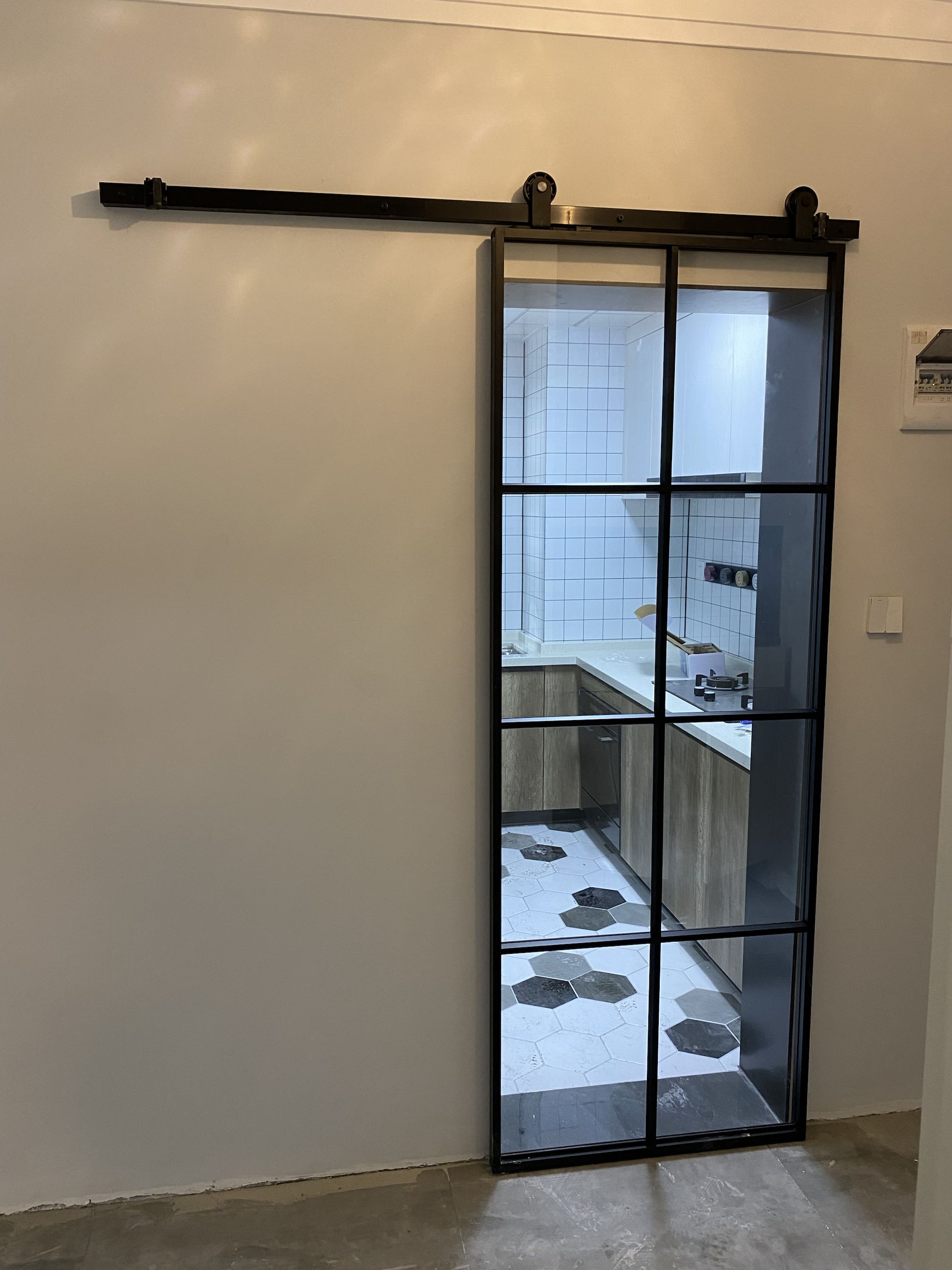 Glass barn door Black fine frame hanging wheel door Black fine frame barn door Changhong Glass barn door