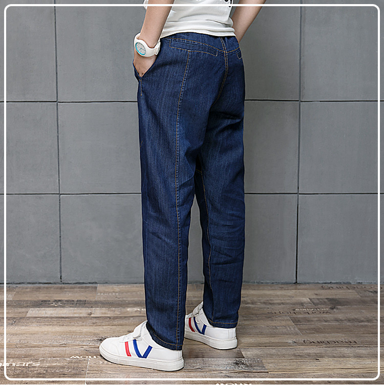 Nam trẻ em lớn jeans trẻ em loose quần trung và nhỏ trẻ em quần âu mùa xuân và mùa thu chất béo boy cộng với phân bón XL quần