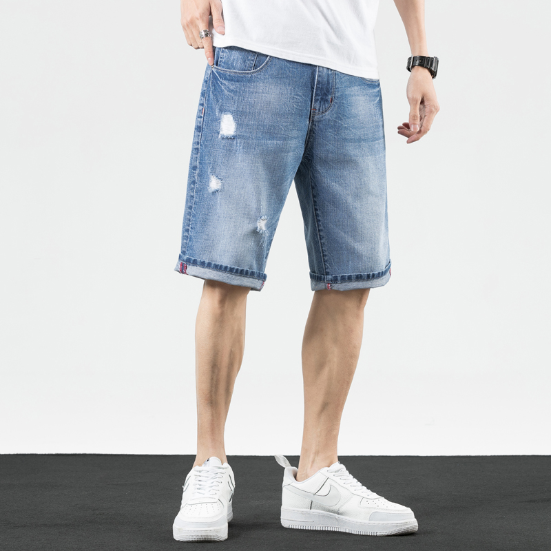 Mùa hè ánh sáng màu lỗ denim quần short mới của nam giới triều Hàn Quốc phiên bản của cơ thể quần năm điểm đàn ông mài ăn xin quần giữa.