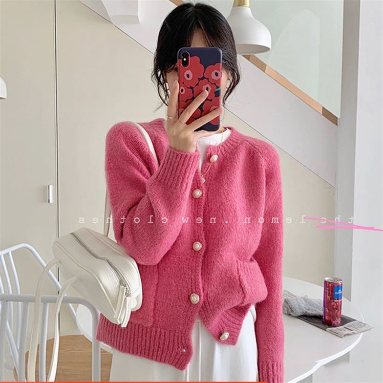 Red raccoon fluff woman in autumn 2021 wears a lax collar loose, lazy glutinous knit coat