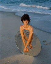 Write a wedding dress photograph decorative props in windy background sea creative photography round acrylic mirror