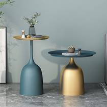 Light luxury marble tea few beds of a small round table with a few sides of the sofa side cabinet of a modern minimalist corner