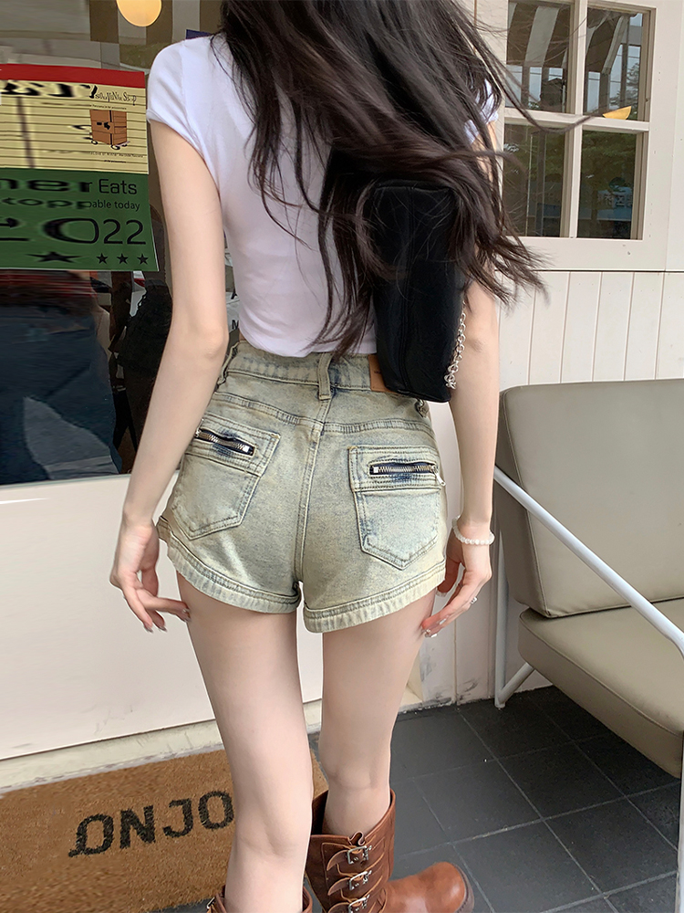 <!--美式复古辣妹牛仔短裤女夏季梨型身材高腰显瘦设计感a字包臀热裤-->