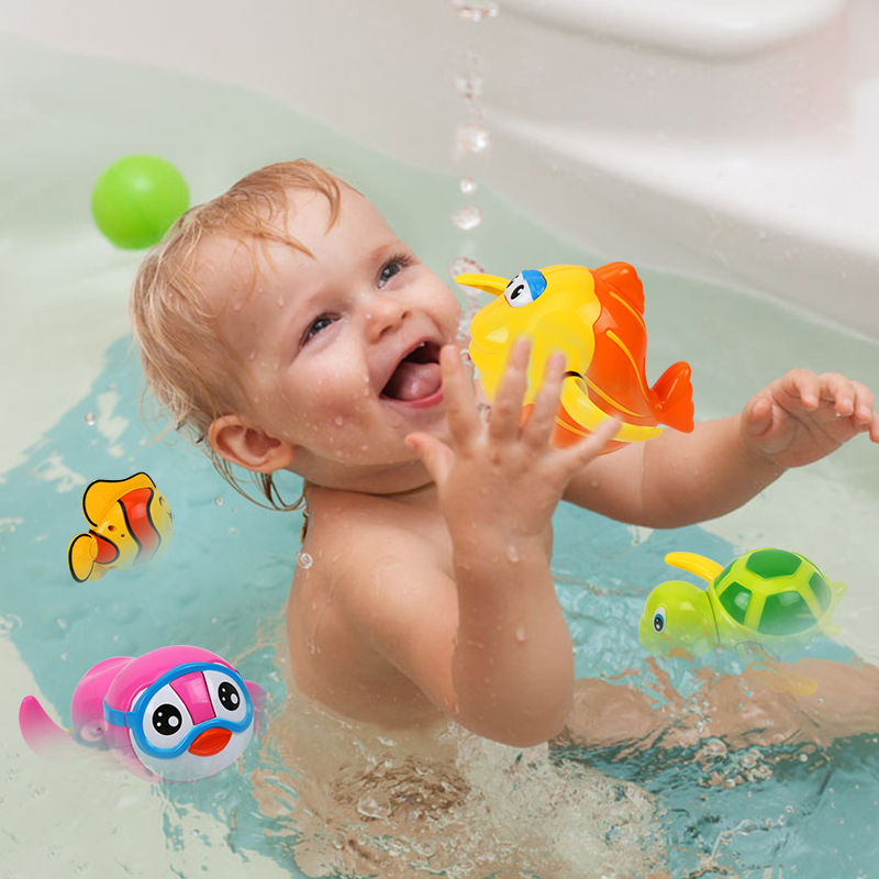 0-1-2 years old infants and young children play toys in the water Children play with small fish Cute little turtles swim in the bath