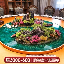 The hotel box round table is decorated in the middle of the table for 30 people.
