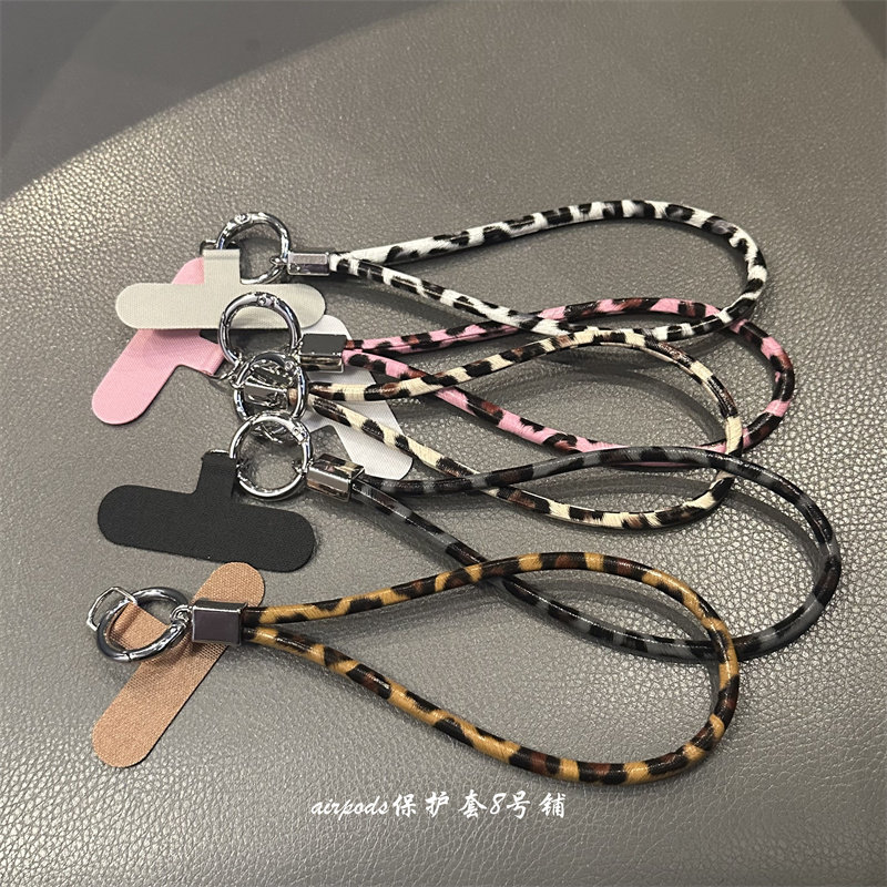 Unique leopard print accessories for phone straps, bags, car keys, AirPods earphone cases, and more.