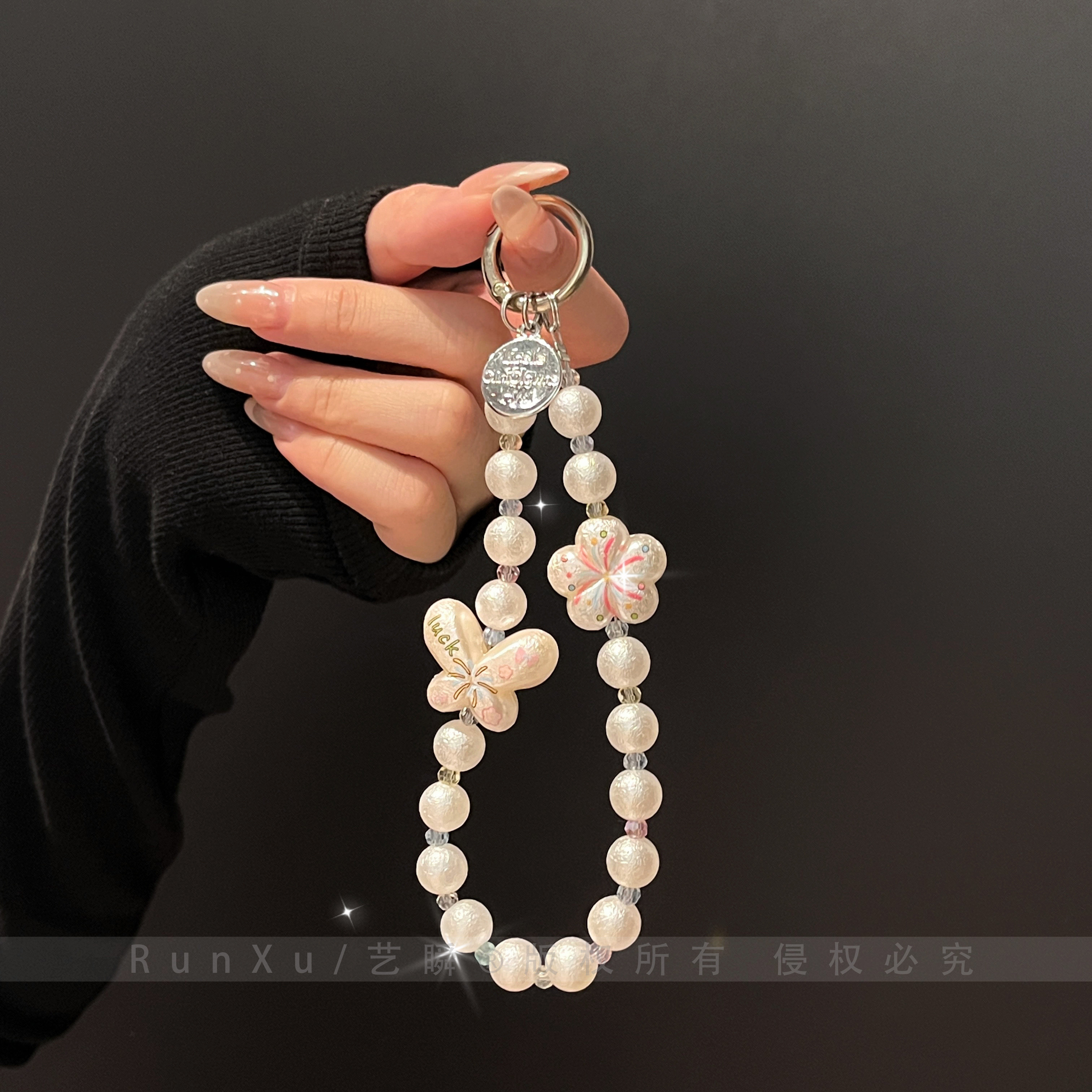 This Instagram-worthy dreamy and healing firework, butterfly, and flower phone charm is suitable for all phone cases and bags, featuring pearl and crystal beads, a keychain, and an anti-loss pendant. A high-value gift for your best friend. Perfect for women.
