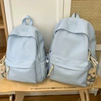 Большой синий кулон в виде белого медведя с разноцветной веревкой