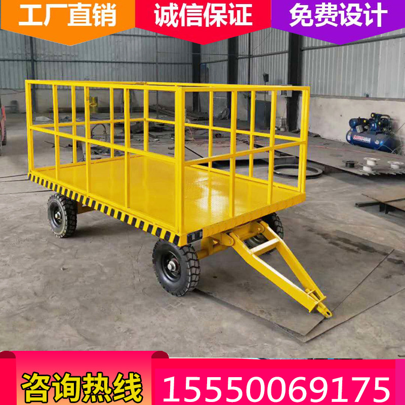 Intra-plant transport of heavy duty vehicles with steering to four-wheel flat Trailer Workshop Logistics Warehouse to move freight caravan 