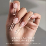 Распространение клея на кристаллическую резинку ногтя, очень тщательные безболезненные быстрые ногти Расширенная бумага, без тирофонная фототерапия.