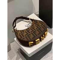 High-end light luxury niche old flower coffee color armpit bag for women 2026 new commuter shoulder crescent bag spring and summer