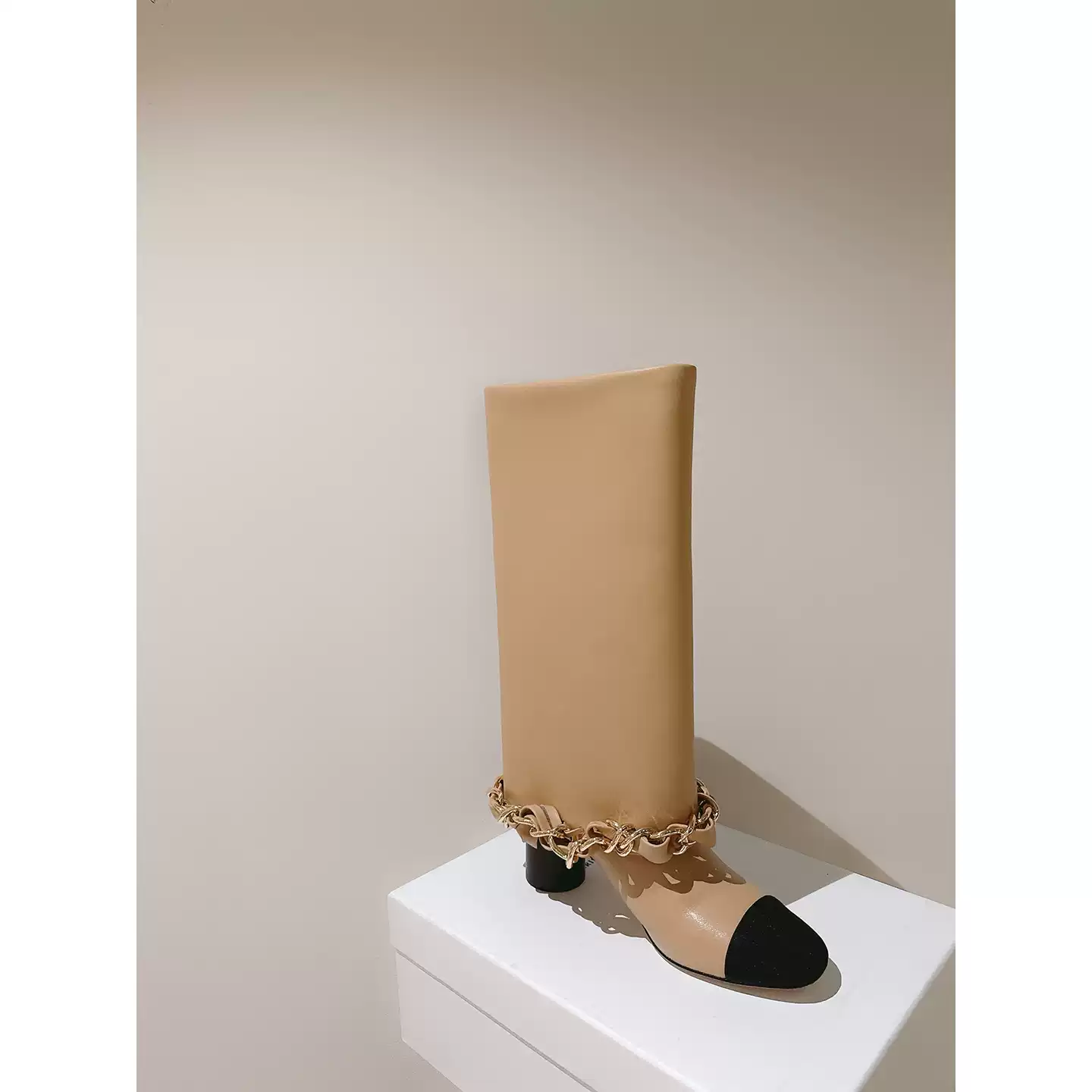 Long boots with thick heels